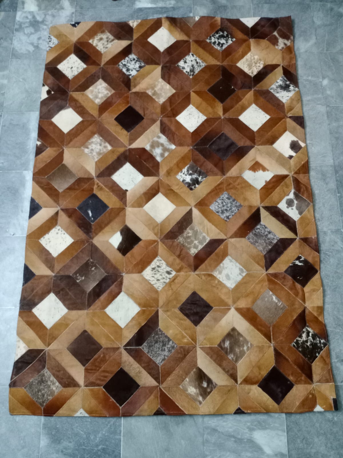 cow skin patchwork rug